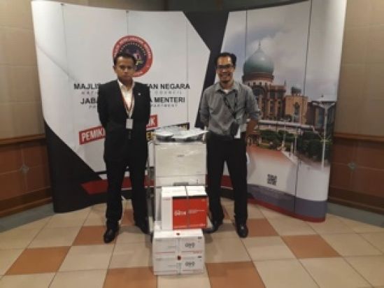 Jabatan Keselamatan Negara representative receiving 2 sets of coloured laser printers LBP712C worth RM9,812