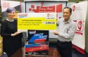 Joon Tan, Carpe Ri co-founder (left) presenting the mock cheque to Mr Chua Hong Wee, National Kidney Foundation CEO (right)